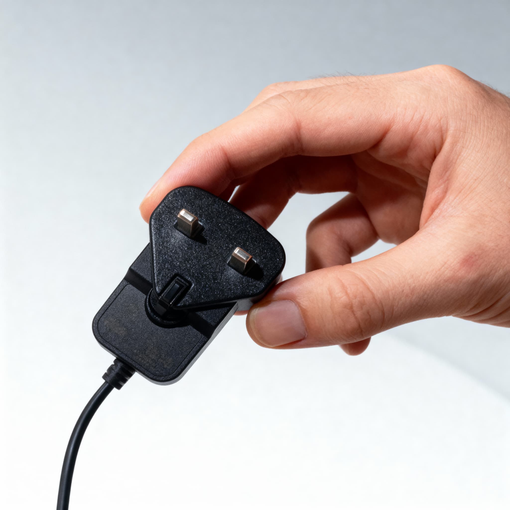 Plug adapter being slid into the power supply body
