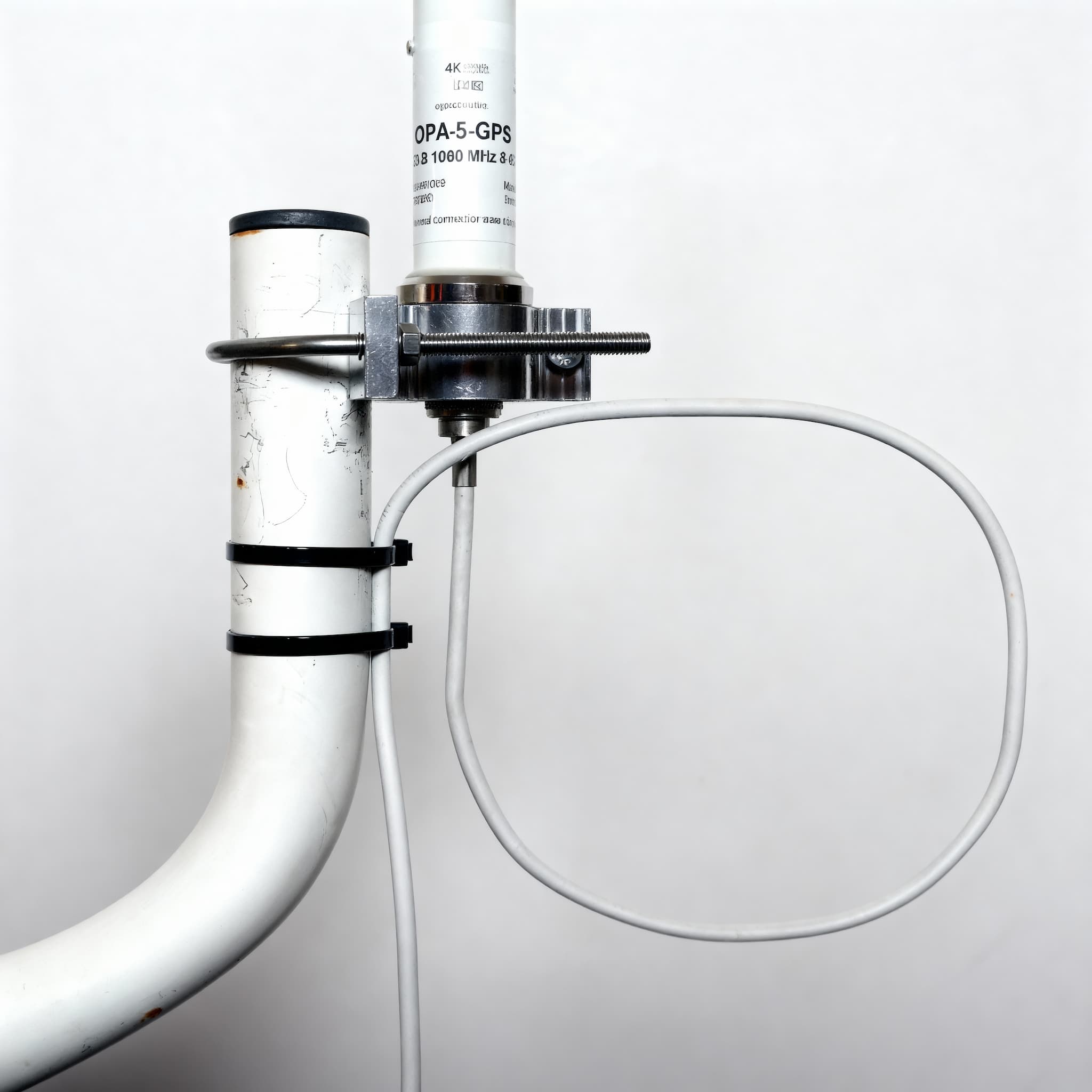 Cable formed into a soft drip loop and secured to the mast